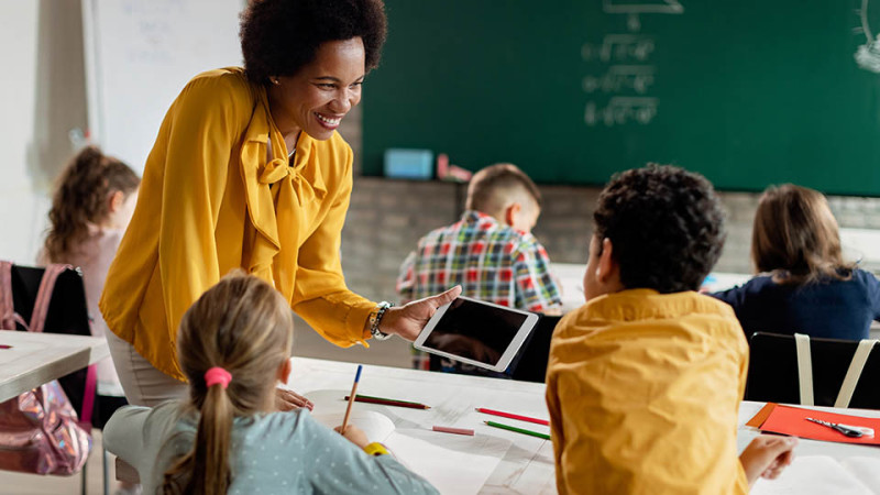 Smiling teacher in classroom